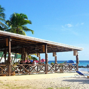 Open beach bar location on white palm beach in the Caribbean