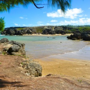 Amazing rustic beach surrounded by high rocks for exceptional film production