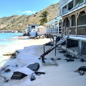 Beach bar with steps and access to sandy beach in Caribbean St. Martin for photo shoot