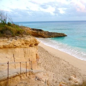 Seaside beach enclave with stairs to beach cove and sea for swim shoot in Saint Martin