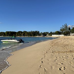 Speed boat on Barbados seashore for commercial video production