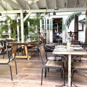 Tropical style beach restaurant with wooden shatters as fashion photo shoot location 