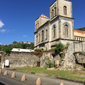 Massive historical brick building semi ruined near road