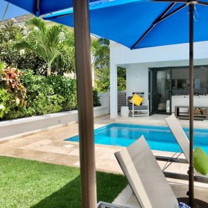 Modern style white bungalow with pool on terrace in Barbados