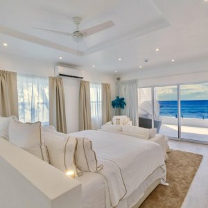 Bedroom all white with view to ocean