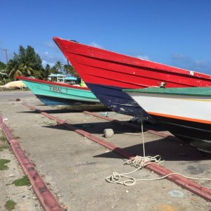 Colorful fishing boats lined up on dry dock on Grenadine Island