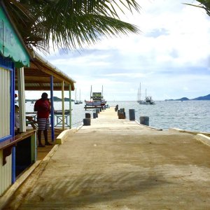 Dock on Grenadine Island for catamarans and fishing boats