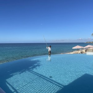 Infinity swimming pool above beach and sea from luxury hotel in Saint Martin