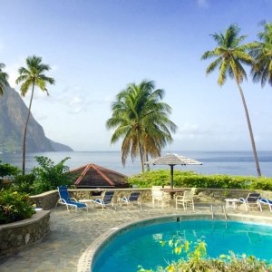 Pool deck rustic style with palm trees st lucia and view to pitons