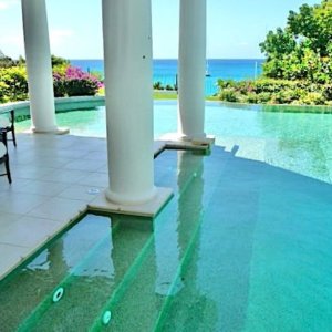 Swimming pool with access from house veranda overlooking the caribban sea